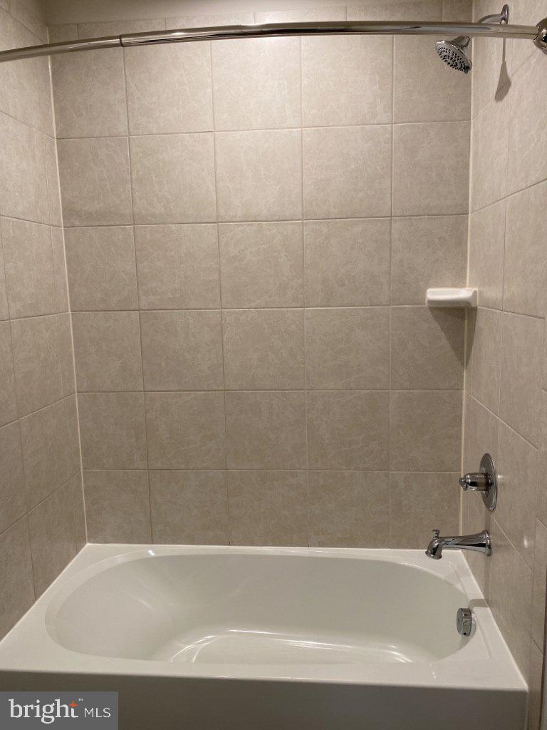 531 View Point Way Fredericksburg, VA 22405 - Photo 30 of 36 Modern tub in a sleek tiled space.