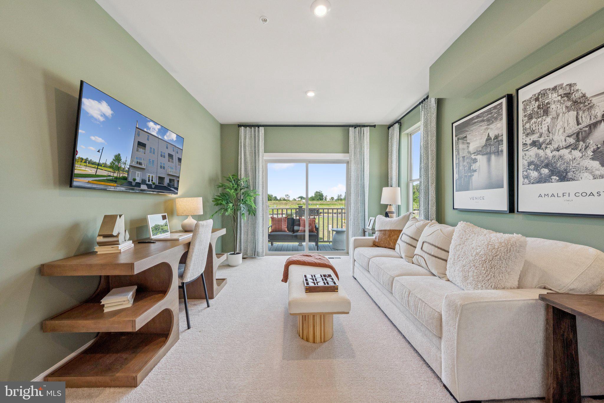 6715 Belcrest Road Hyattsville, MD 20782 - Photo 15 of 28 a living room with furniture and large windows