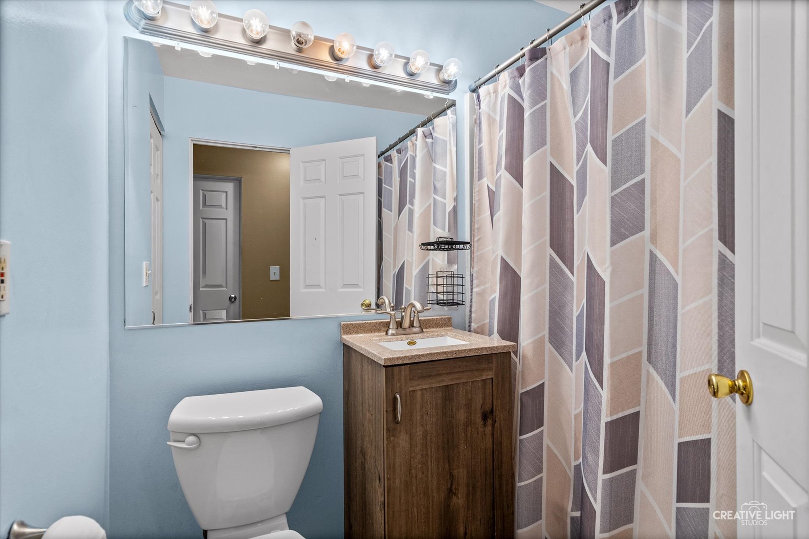 54 Sierra Road Montgomery, IL 60538 - Photo 13 of 17 a bathroom with a toilet sink and mirror