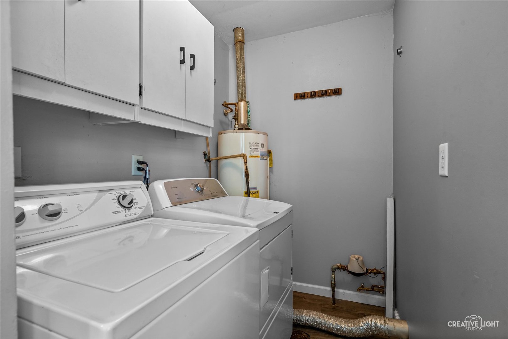 54 Sierra Road Montgomery, IL 60538 - Photo 8 of 17 a utility room with dryer and washer