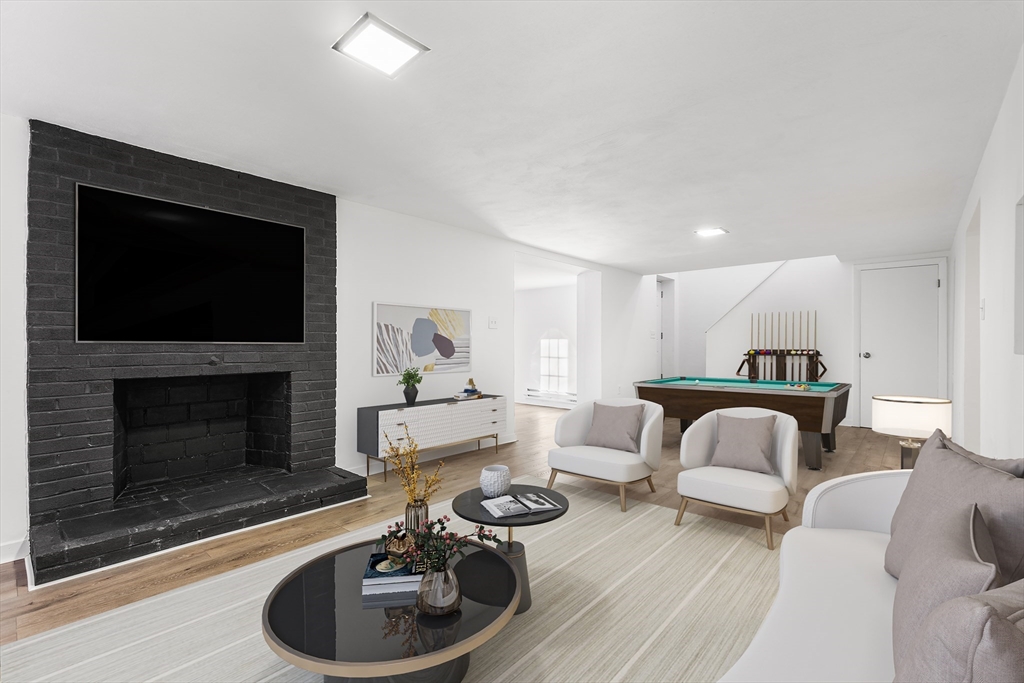 7 Pinewood Road Peabody, MA 01960 - Photo 5 of 11 a living room with furniture and a fireplace