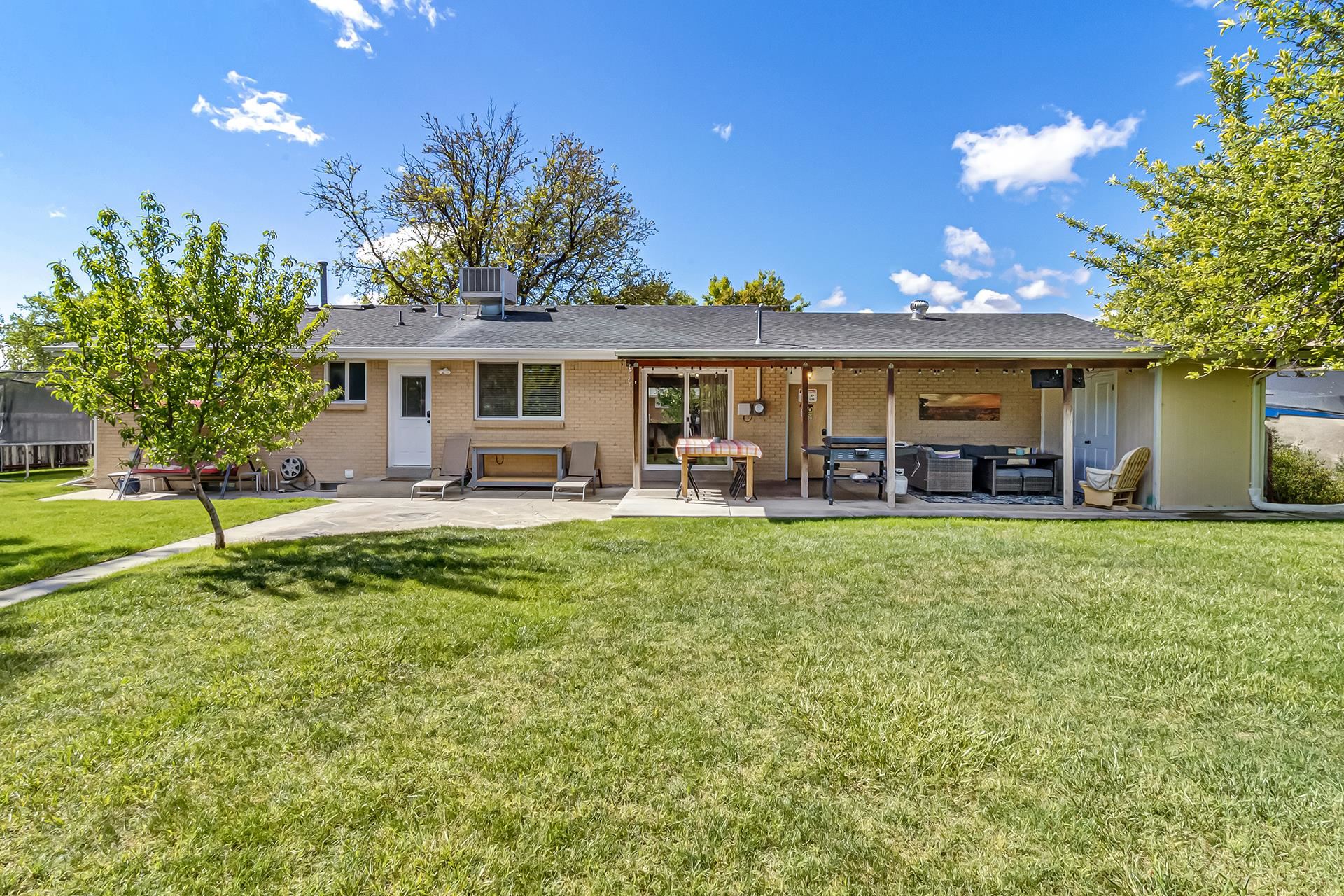 2118 Saguaro Road Grand Junction, CO 81507 - Photo 27 of 42 a view of a house with a backyard porch and sitting area
