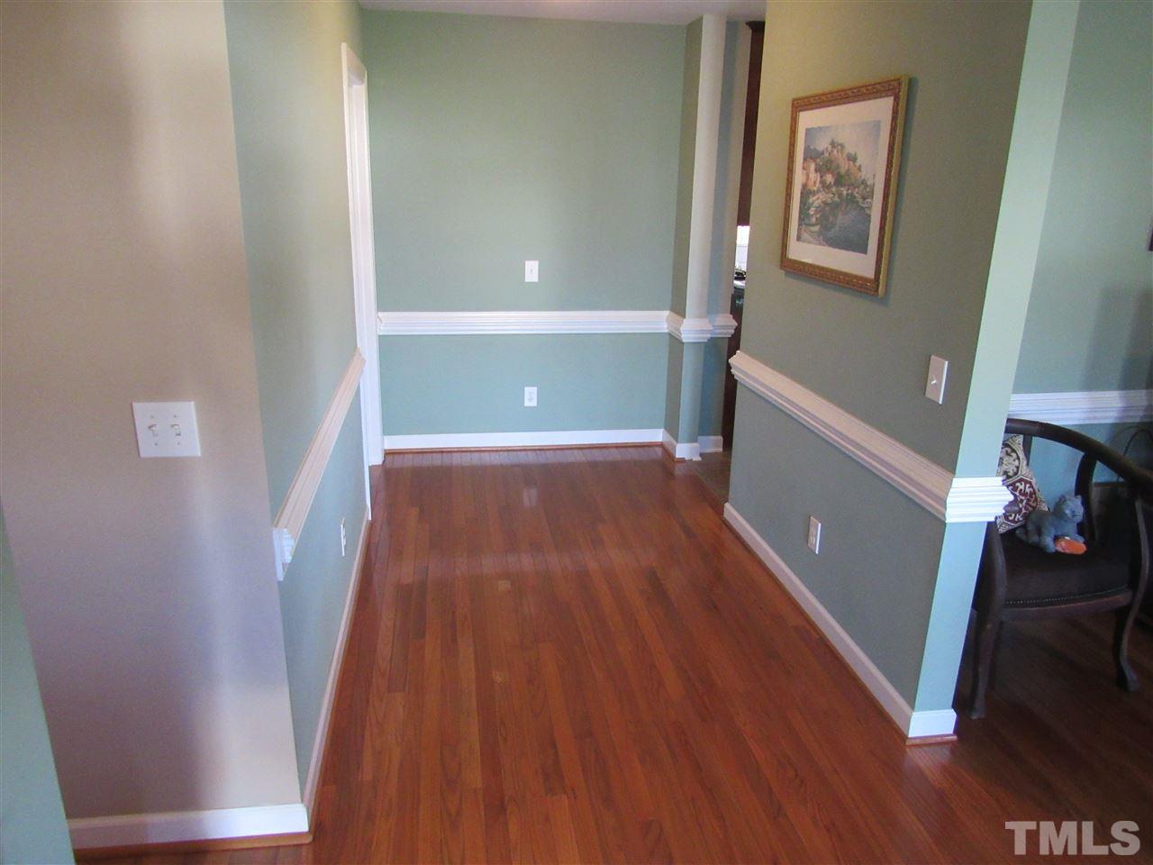 279 Steve Ridge Willow Spring, NC 27592 - Photo 11 of 25 a view of a room with wooden floor and staircase