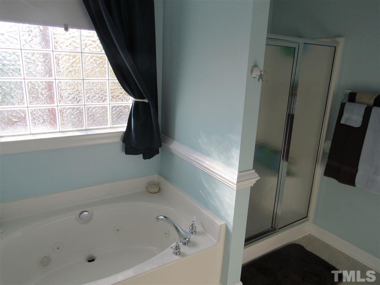 279 Steve Ridge Willow Spring, NC 27592 - Photo 14 of 25 a bathroom with a bathtub