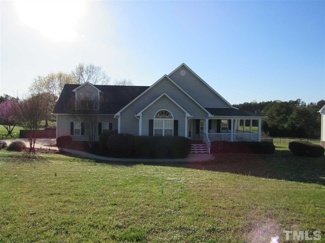 279 Steve Ridge Willow Spring, NC 27592 - Photo 25 of 25 a front view of a house with a yard and garage