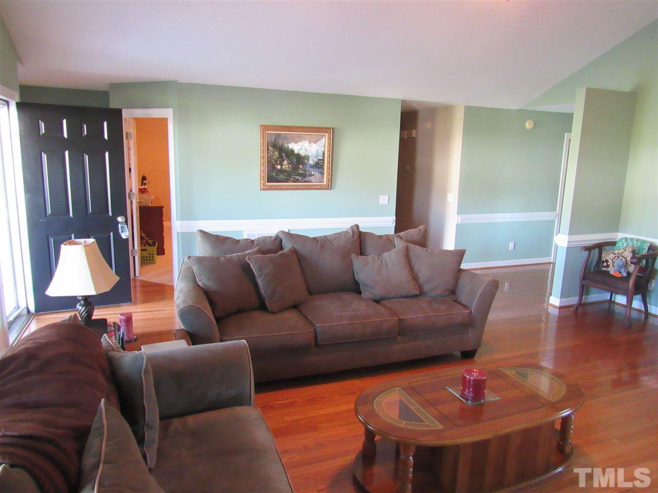 279 Steve Ridge Willow Spring, NC 27592 - Photo 4 of 25 a living room with furniture and a lamp