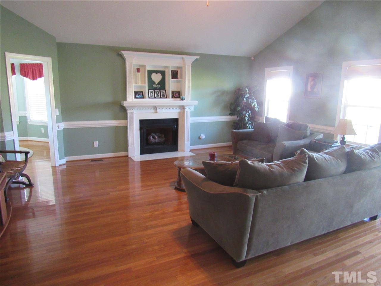 279 Steve Ridge Willow Spring, NC 27592 - Photo 6 of 25 a living room with furniture and a fireplace