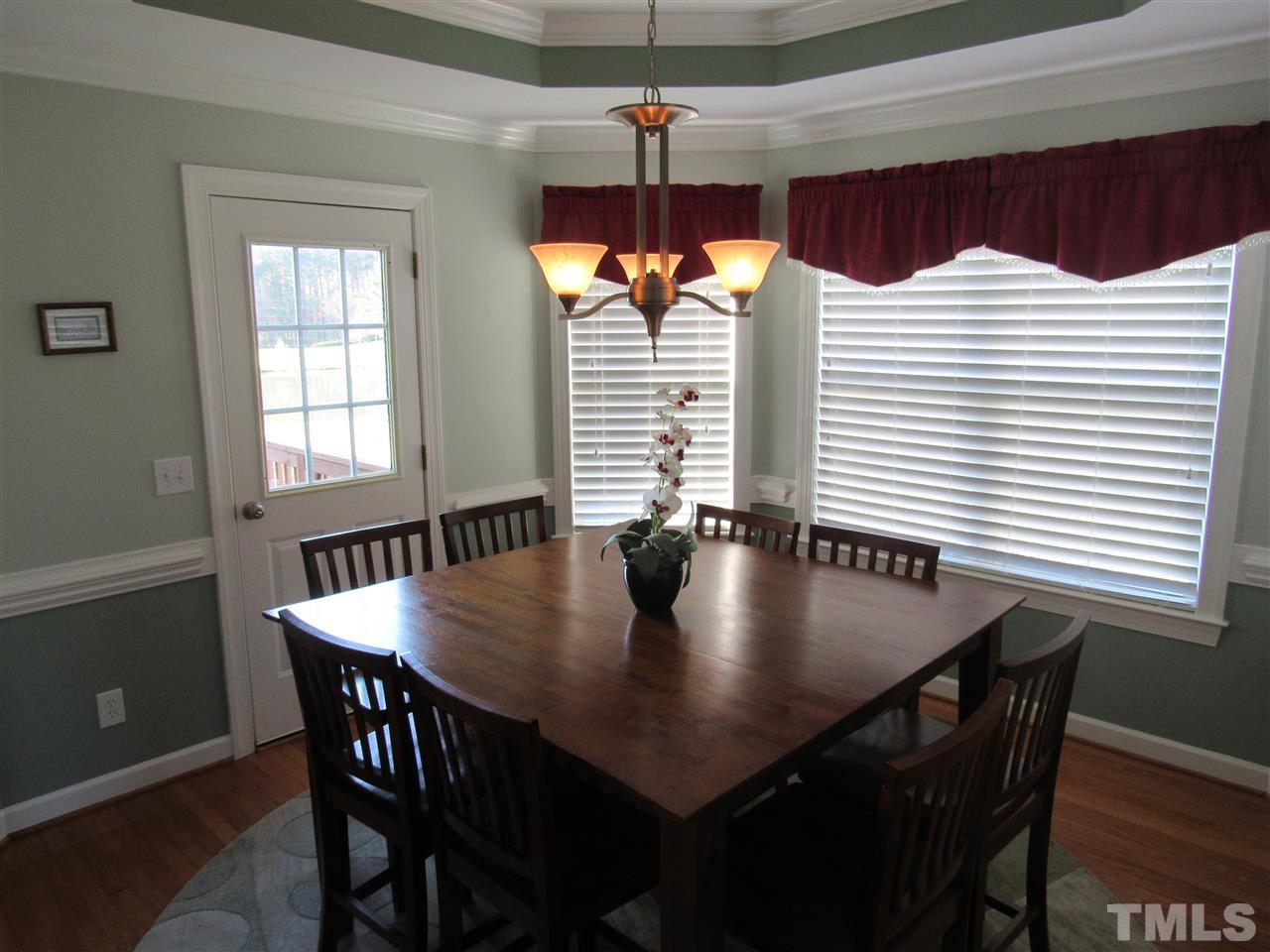 279 Steve Ridge Willow Spring, NC 27592 - Photo 7 of 25 a view of a dining room with furniture and window