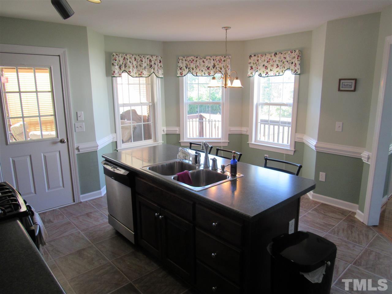 279 Steve Ridge Willow Spring, NC 27592 - Photo 10 of 25 a kitchen with granite countertop a sink counter and cabinets