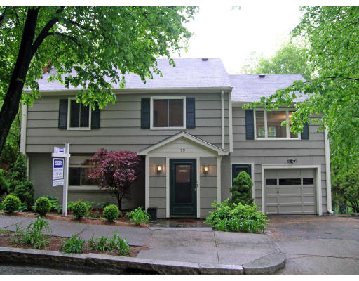75 Wolcott Road Brookline, MA 02467 - Photo 1 of 16 a front view of a house with garden