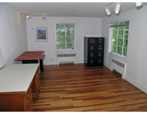 75 Wolcott Road Brookline, MA 02467 - Photo 12 of 16 a room with wooden floor and windows