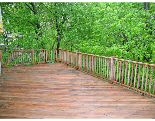 75 Wolcott Road Brookline, MA 02467 - Photo 3 of 16 a view of balcony with wooden floor