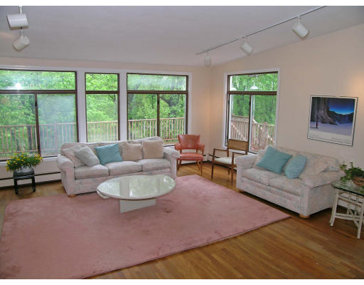 75 Wolcott Road Brookline, MA 02467 - Photo 5 of 16 a living room with furniture and a large window