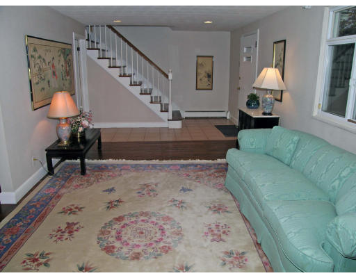 75 Wolcott Road Brookline, MA 02467 - Photo 8 of 16 a living room with furniture and a lamp