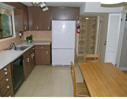 75 Wolcott Road Brookline, MA 02467 - Photo 10 of 16 a kitchen with a refrigerator and a sink
