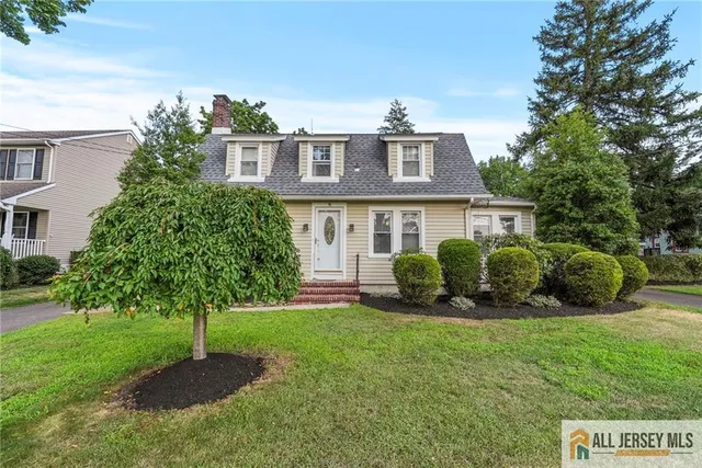a view of a house with a backyard