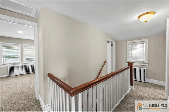 a view of a hallway with bedroom