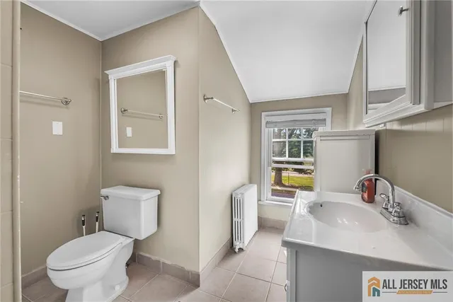 a bathroom with a sink toilet and tub