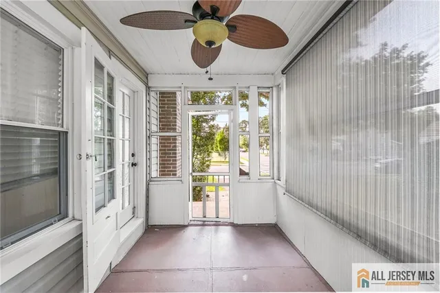 a bathroom with a tub and a large window