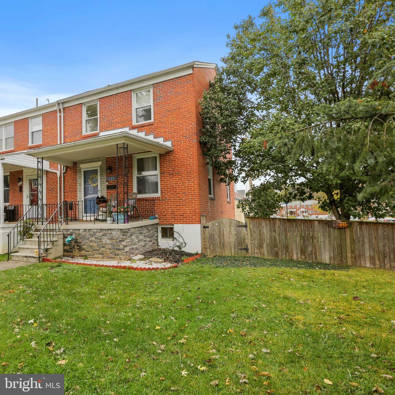 215 Cherrydell Road Catonsville, MD 21228 - Photo 1 of 20 a front view of a house with a yard table and chairs