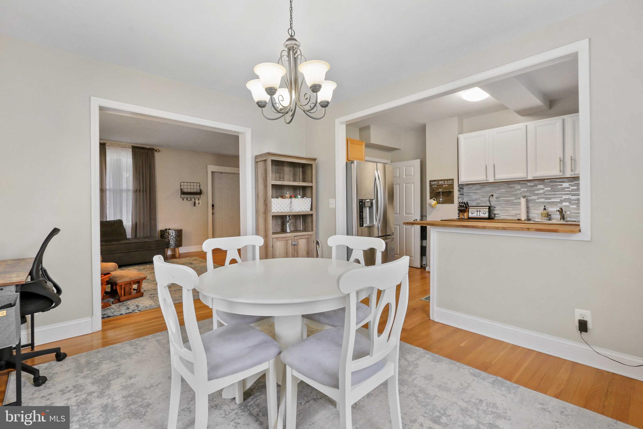215 Cherrydell Road Catonsville, MD 21228 - Photo 11 of 20 a view of a dining room with furniture and chandelier