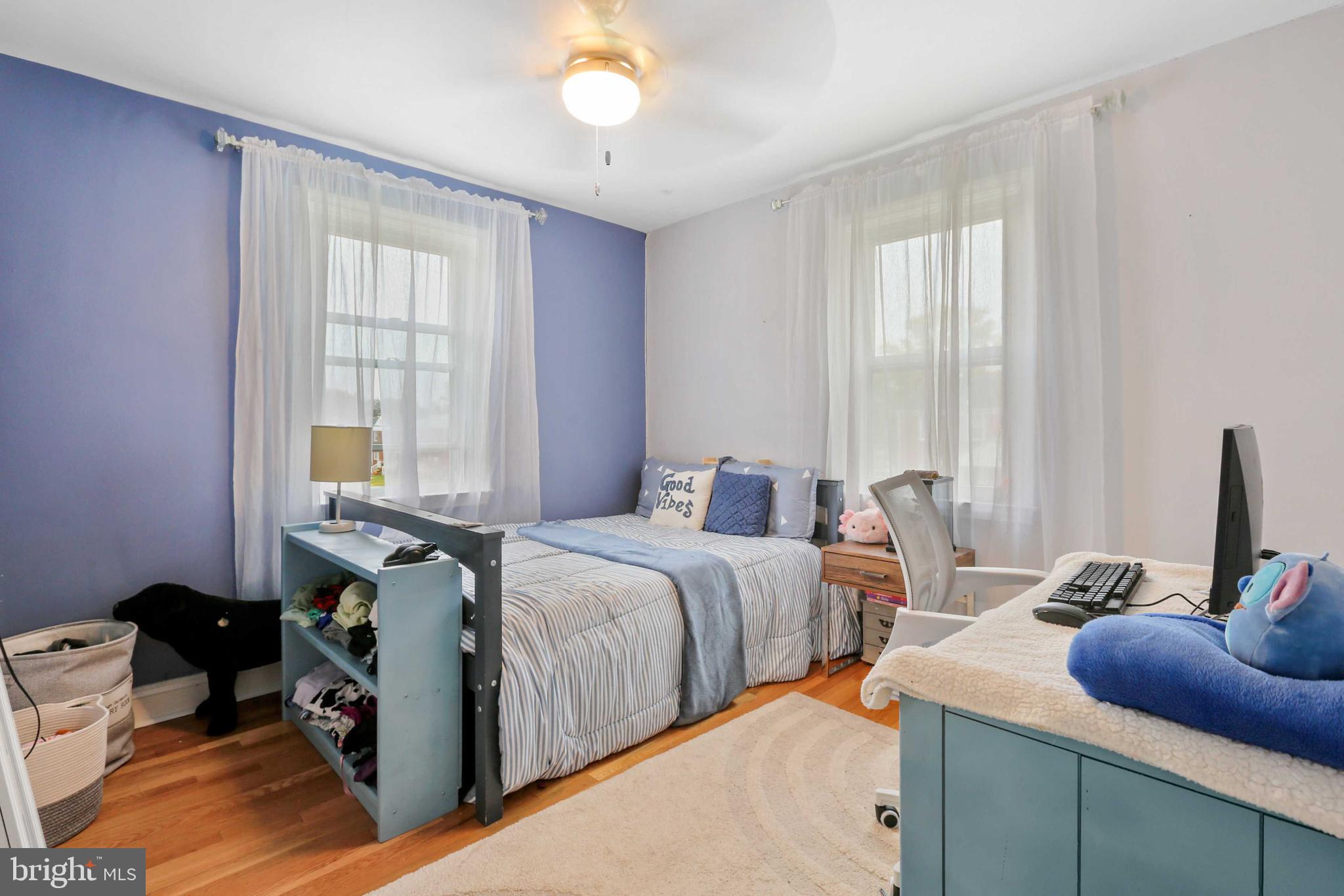 215 Cherrydell Road Catonsville, MD 21228 - Photo 13 of 20 a bedroom with two beds and a window