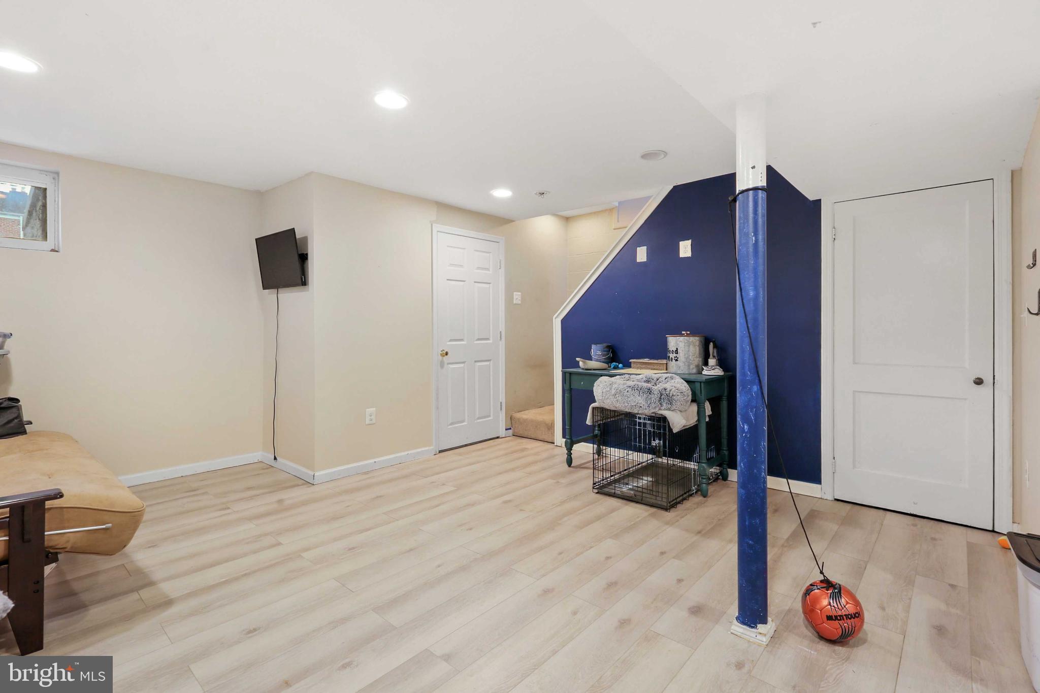 215 Cherrydell Road Catonsville, MD 21228 - Photo 16 of 20 a bedroom with a bed and a chandelier