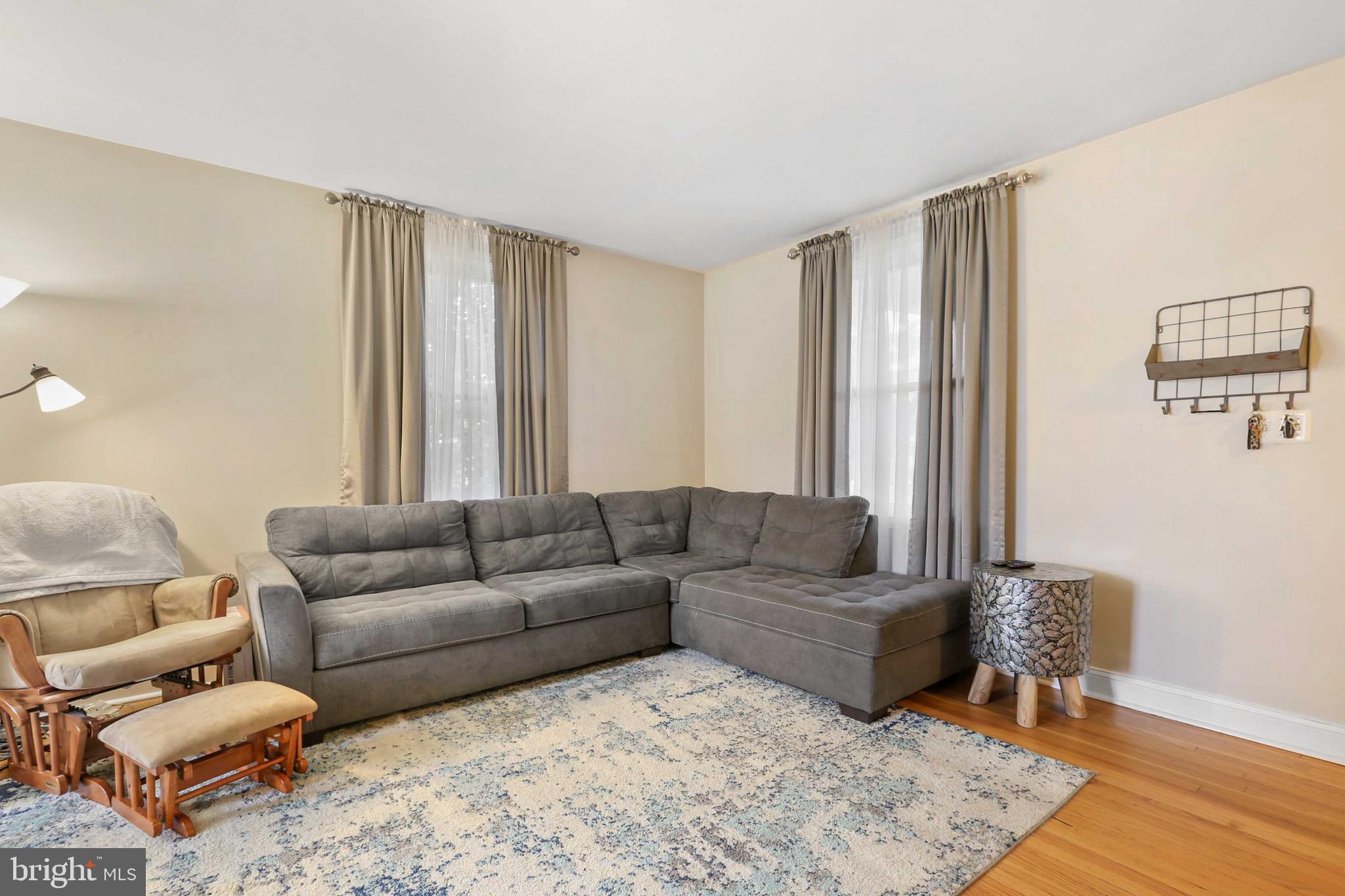 215 Cherrydell Road Catonsville, MD 21228 - Photo 4 of 20 a living room with furniture and a couch