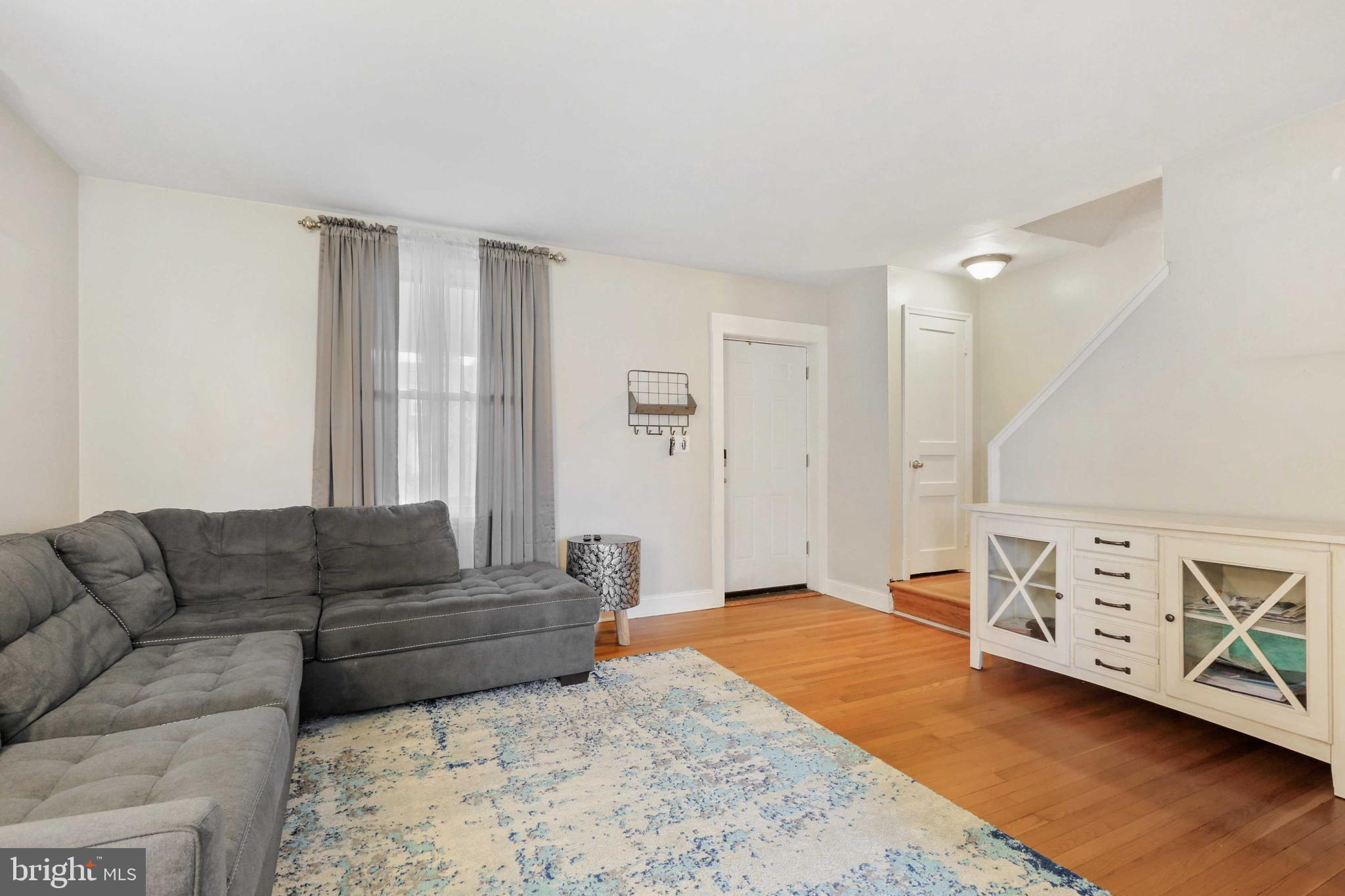 215 Cherrydell Road Catonsville, MD 21228 - Photo 5 of 20 a living room with furniture and wooden floor