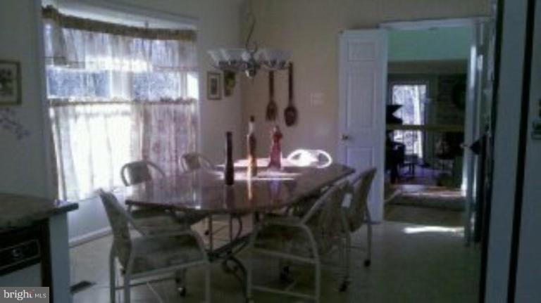 209 Bonifant Road Silver Spring, MD 20905 - Photo 11 of 25 Kitchen table matching granite