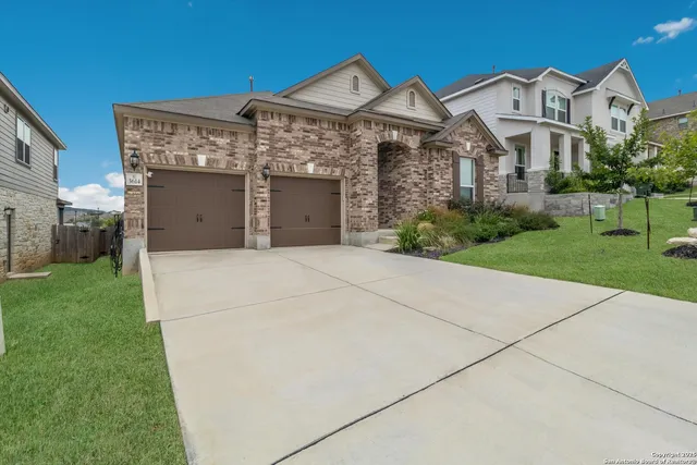 a front view of a house with yard