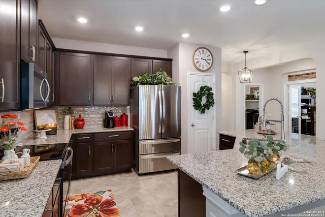 a kitchen view of counter top space cabinets and appliances