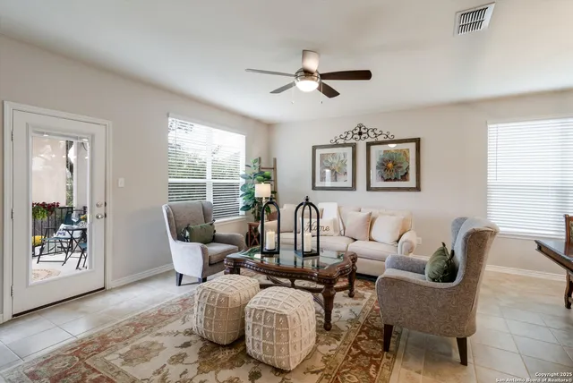 a living room with furniture and windows