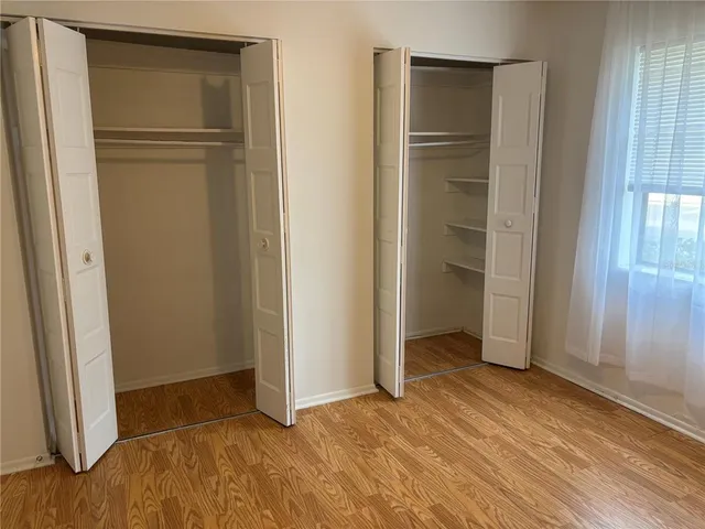an empty room with closet area