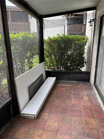 a view of two chairs in the balcony