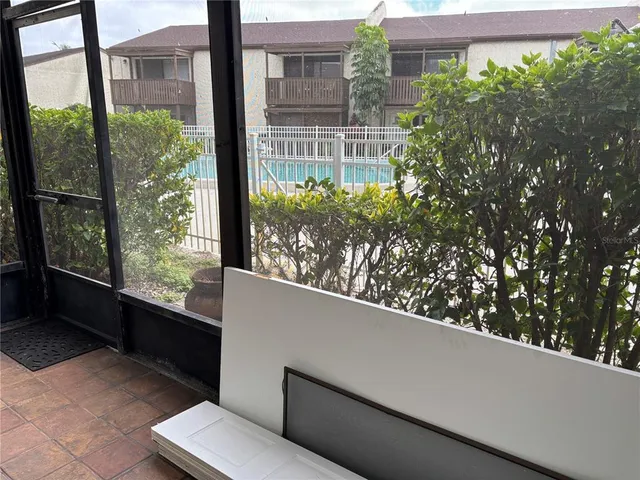 a view of a balcony with a tree