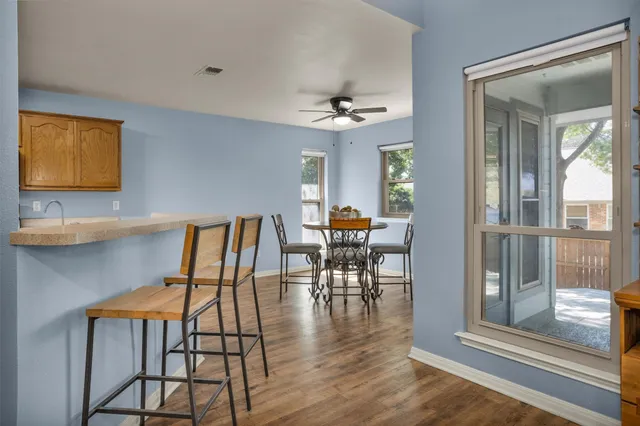 a view of a livingroom with furniture and wooden floor