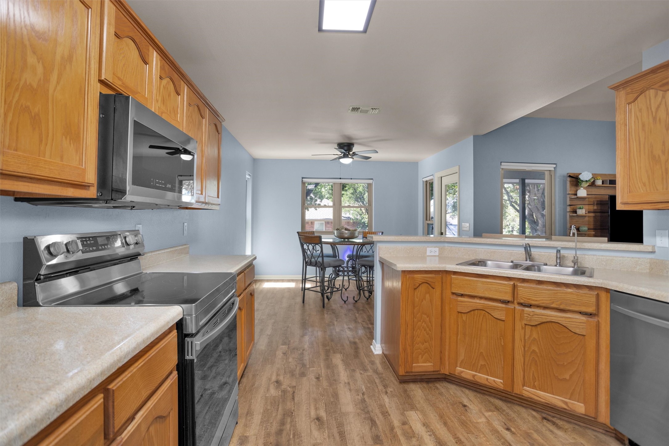 1906 Round Table New Braunfels, TX 78130 - Photo 14 of 46 a kitchen with stainless steel appliances granite countertop sink stove top oven and cabinets