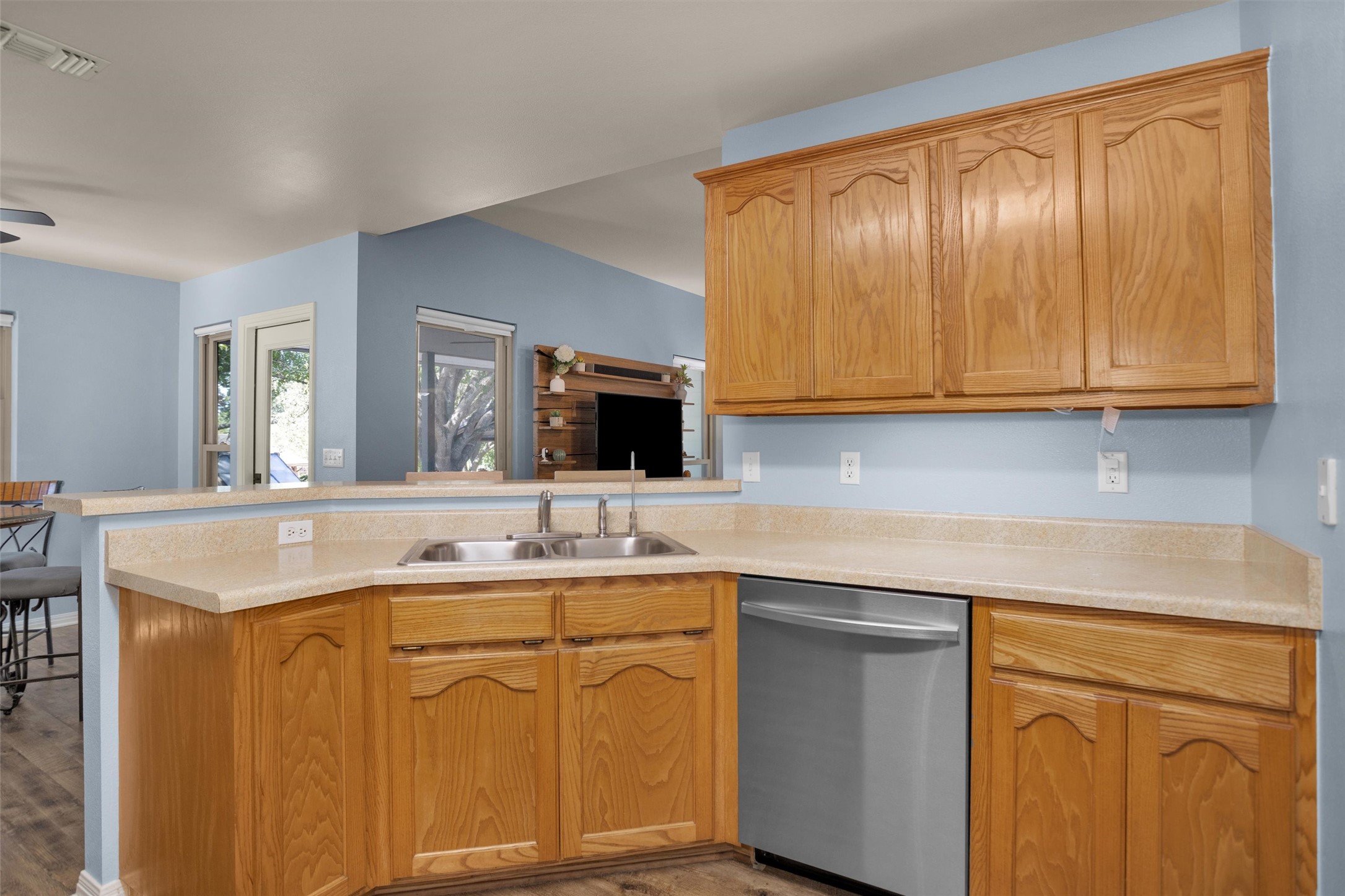 1906 Round Table New Braunfels, TX 78130 - Photo 15 of 46 a kitchen with stainless steel appliances granite countertop a sink and cabinets