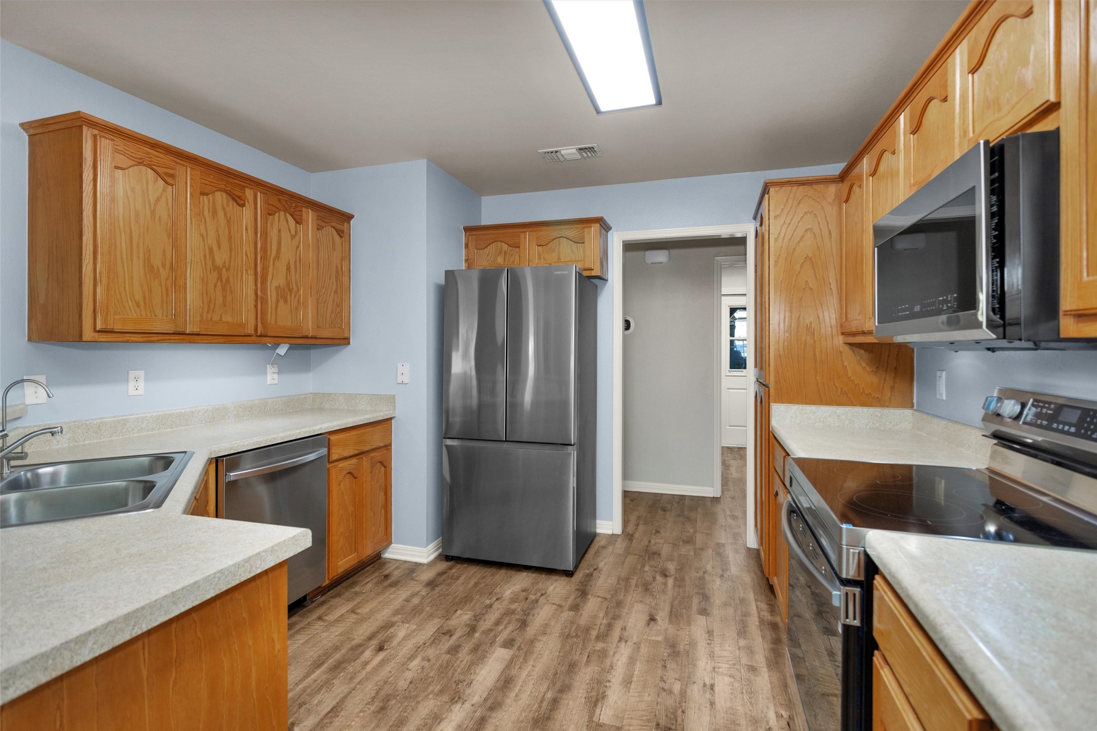 1906 Round Table New Braunfels, TX 78130 - Photo 16 of 46 a kitchen with a refrigerator stove and sink