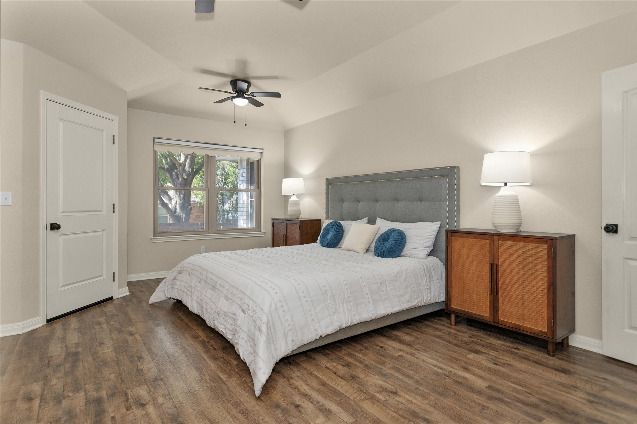 1906 Round Table New Braunfels, TX 78130 - Photo 21 of 46 a bedroom with a large bed a chandelier and windows