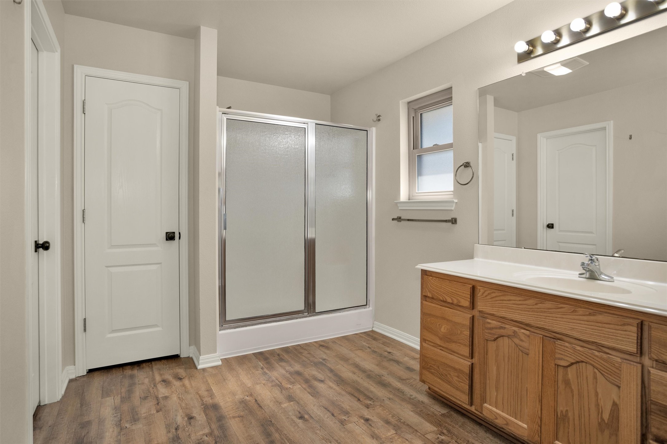 1906 Round Table New Braunfels, TX 78130 - Photo 22 of 46 a bathroom with a sink a mirror and a shower