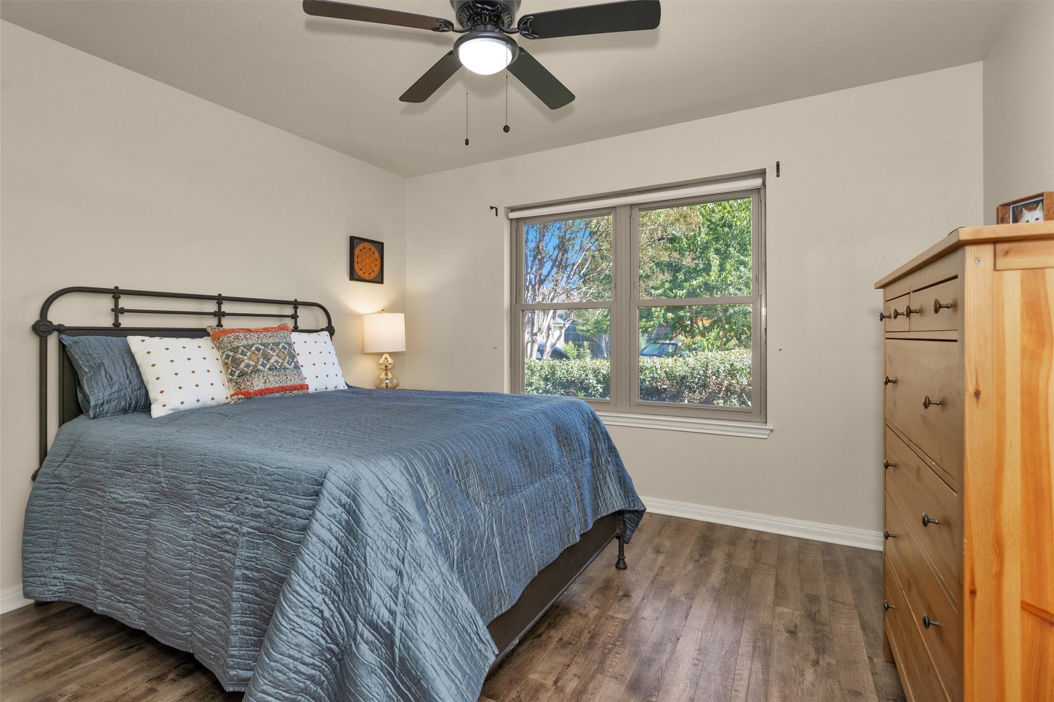 1906 Round Table New Braunfels, TX 78130 - Photo 24 of 46 a bedroom with a bed and wooden floor