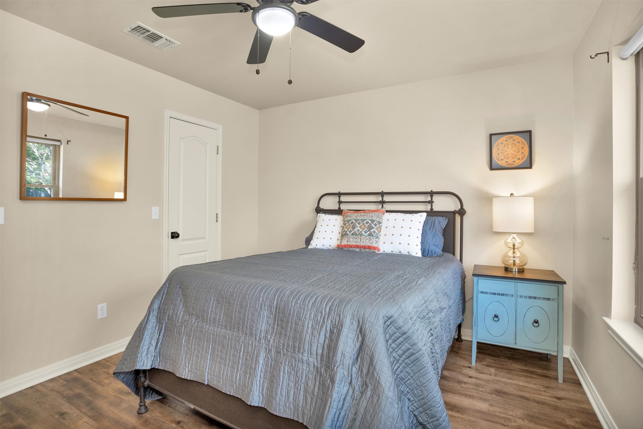 1906 Round Table New Braunfels, TX 78130 - Photo 25 of 46 a bedroom with a bed and a chandelier