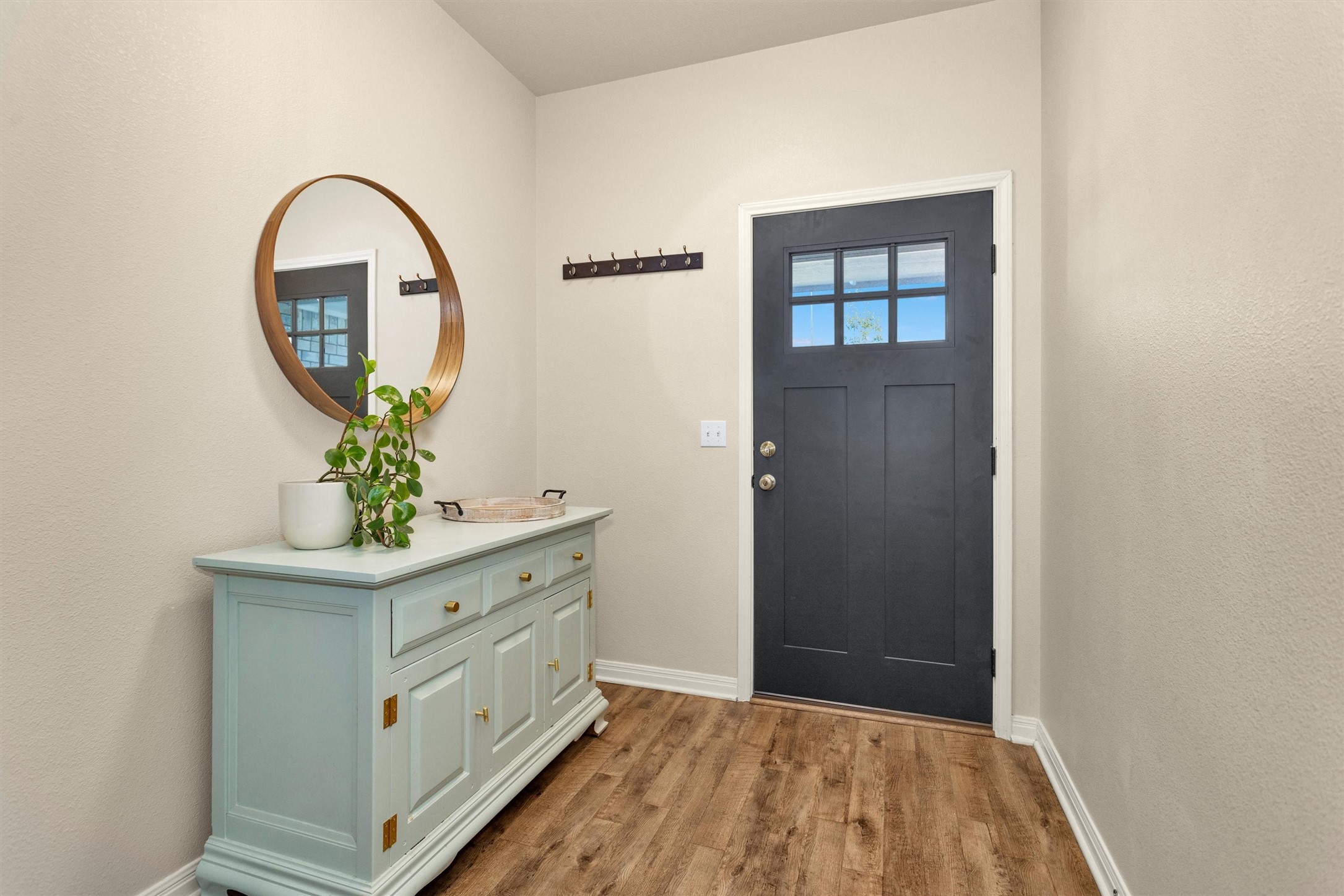 1906 Round Table New Braunfels, TX 78130 - Photo 4 of 46 a view of an entryway with wooden floor