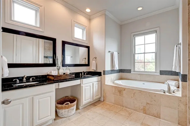 a bathroom with a bathtub and shower