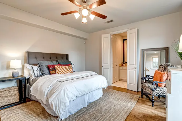 a bedroom with a bed and a chair