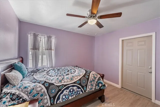 a bedroom with a bed dresser and a window