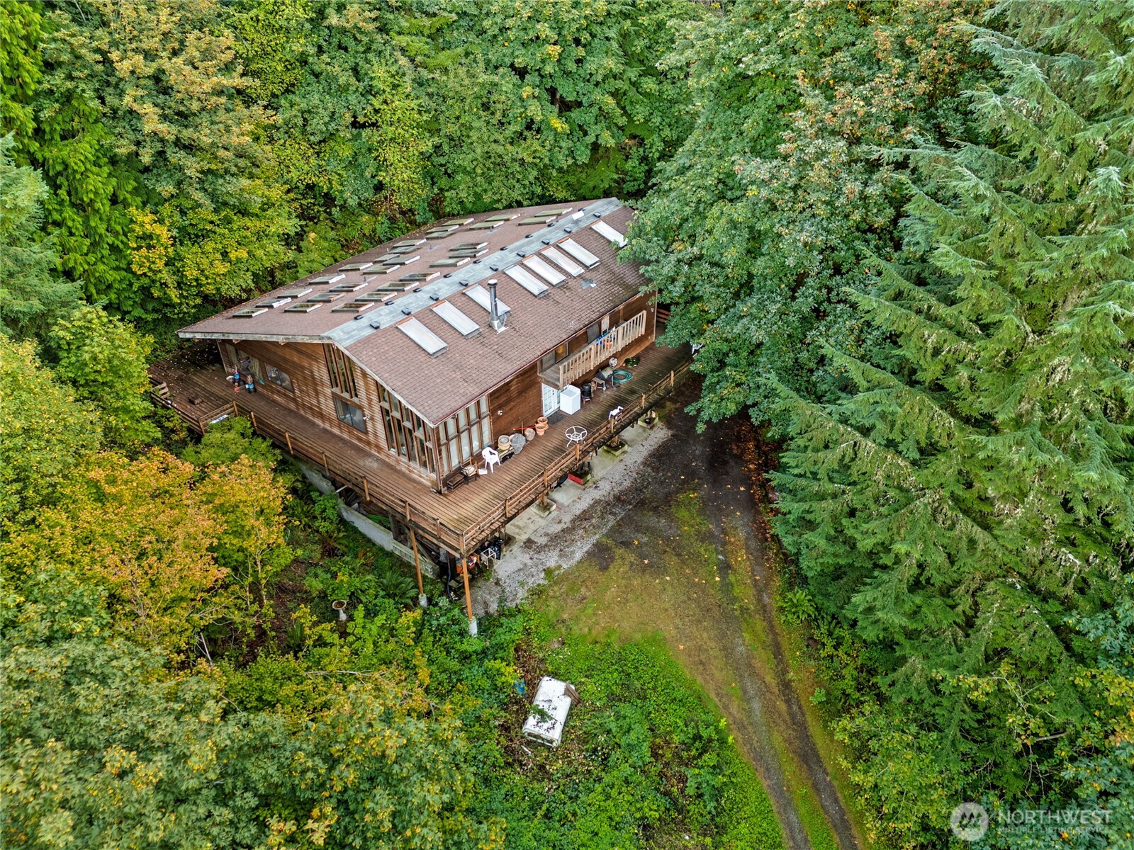 17311 Renton-Maple Valley Road Renton, WA 98058 - Photo 11 of 13 a view of a house with a small yard and large trees