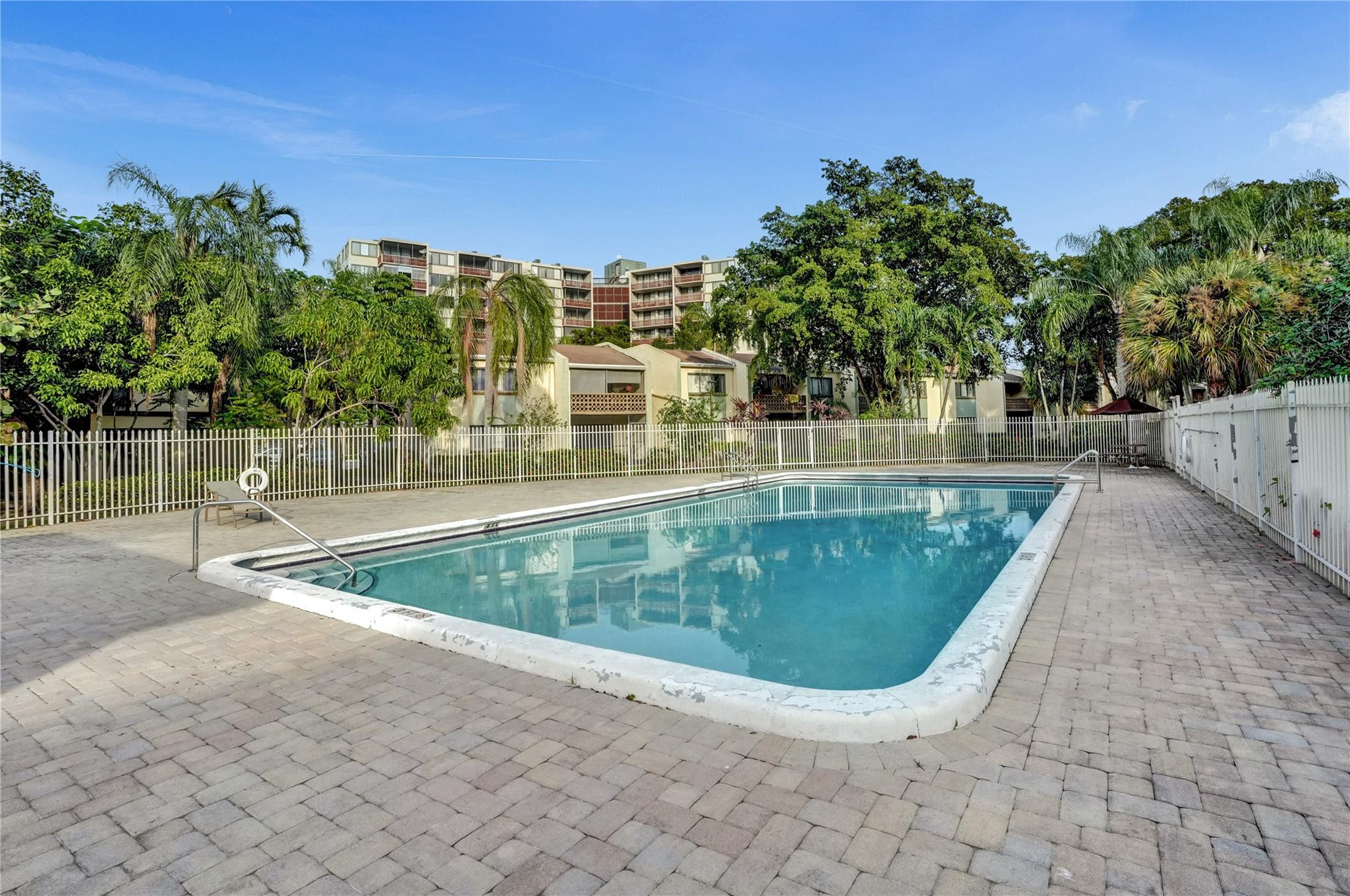 4222 Inverrary Boulevard, Unit 4810 Lauderhill, FL 33319 - Photo 62 of 63 a view of a swimming pool with a yard